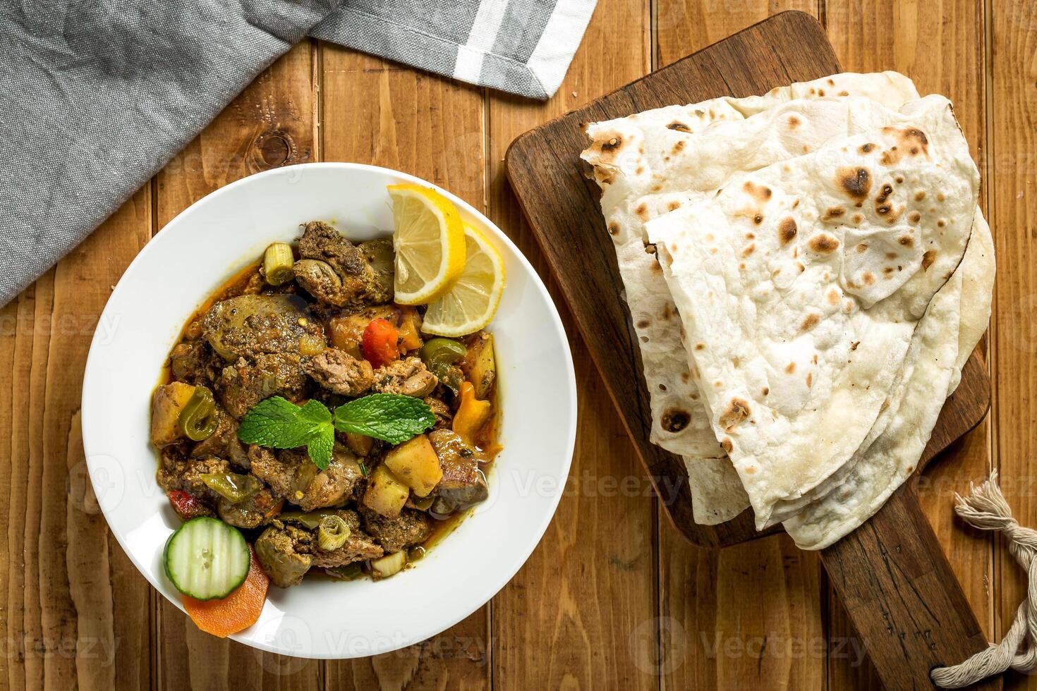 Arabic Chicken Liver with pita bread served in plate isolated on wooden table top view of arabian food photo