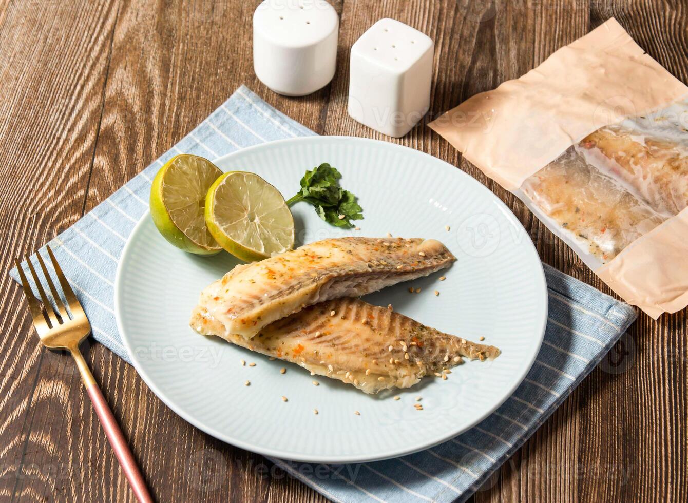 Thai Lime Shufei Snapper fish with red chilli served in plate isolated on napkin side view of taiwan food photo