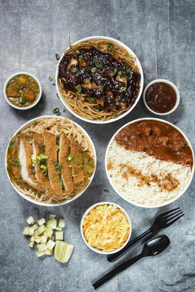 Teriyaki Grilled Chicken Noodles, Katsu Chicken Noodle, Butter Chicken with Rice served in bowl isolated on grey background top view of assorted japanese food verity photo