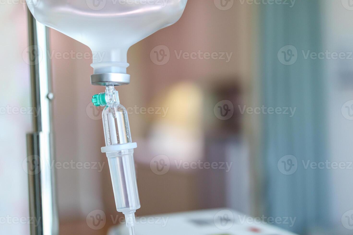 Close up medical intravenous IV drip in hospital background photo