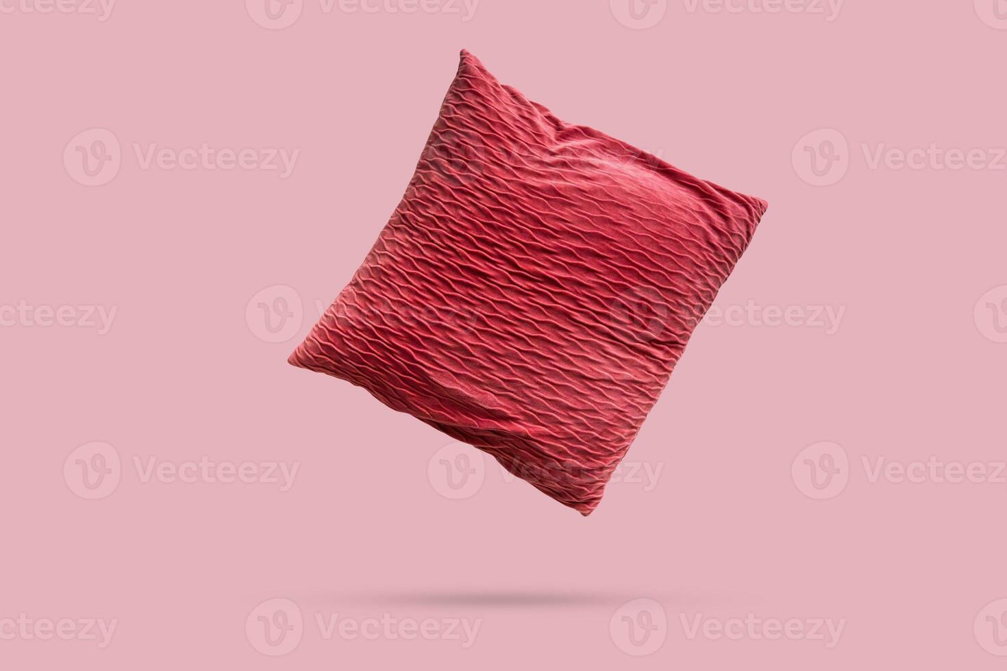 Red pillow Isolated on brown background photo