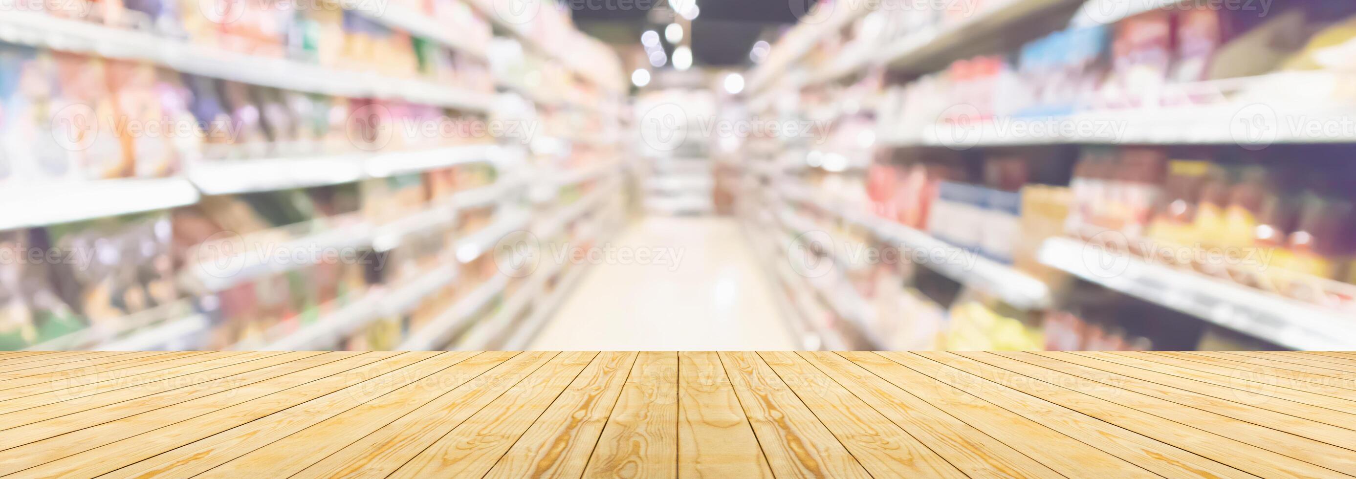 Empty wood table top with supermarket blurred background for product display photo