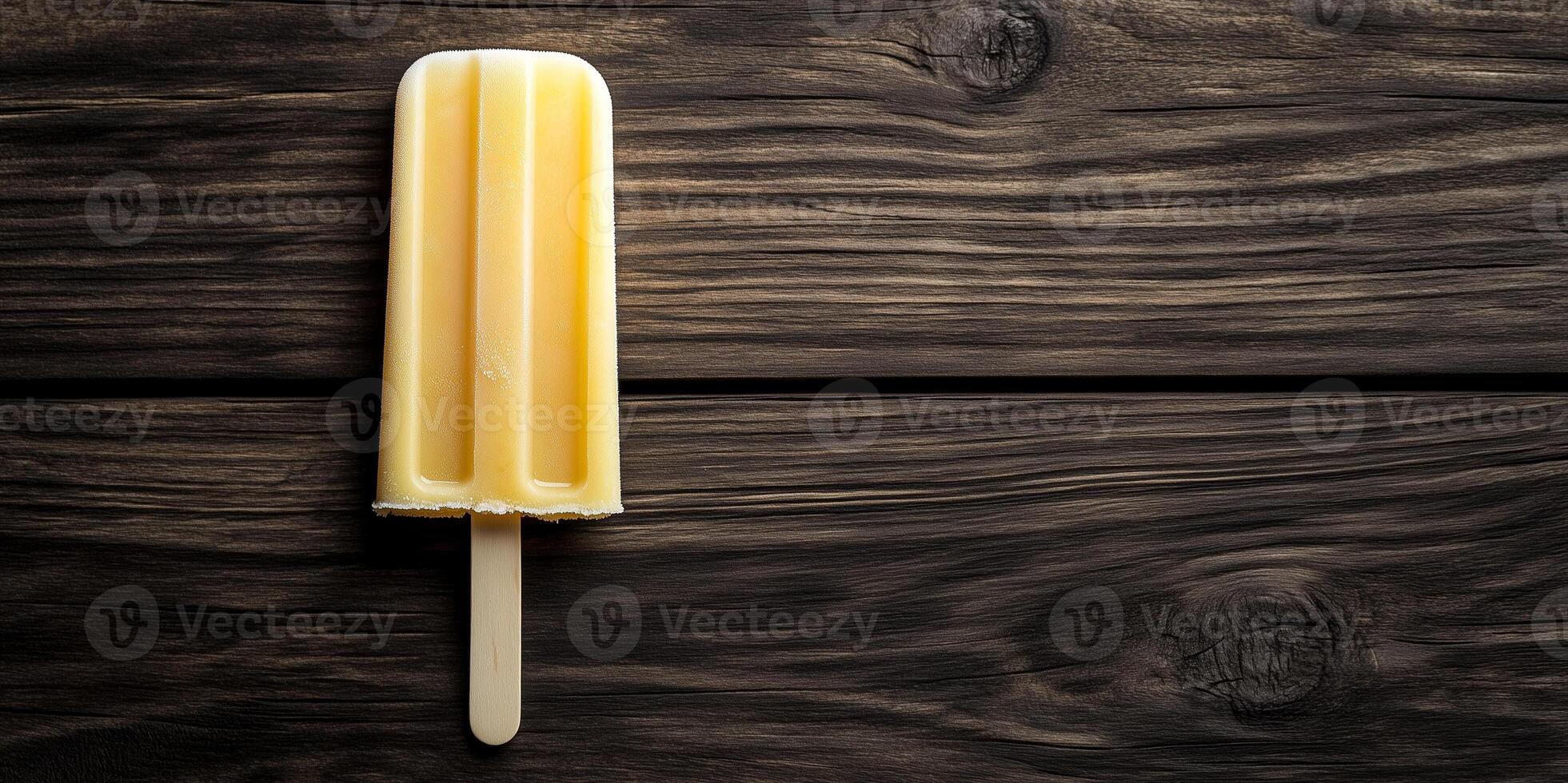 Popsicle drip catcher attachment demonstrated on wooden popsicle stick photo