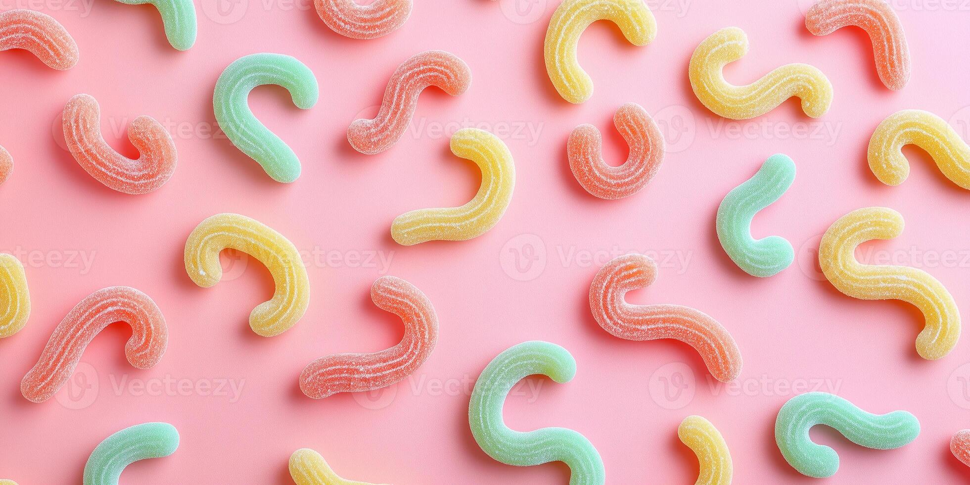 Overhead shot of worm-shaped sweets spelling out a message on a surface photo