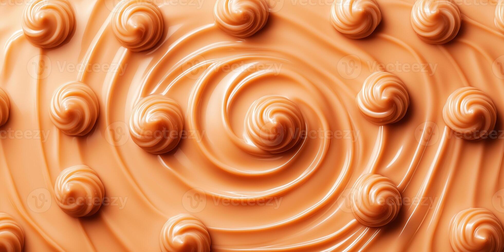 Overhead view of soft caramel candies creating a swirl pattern on surface photo