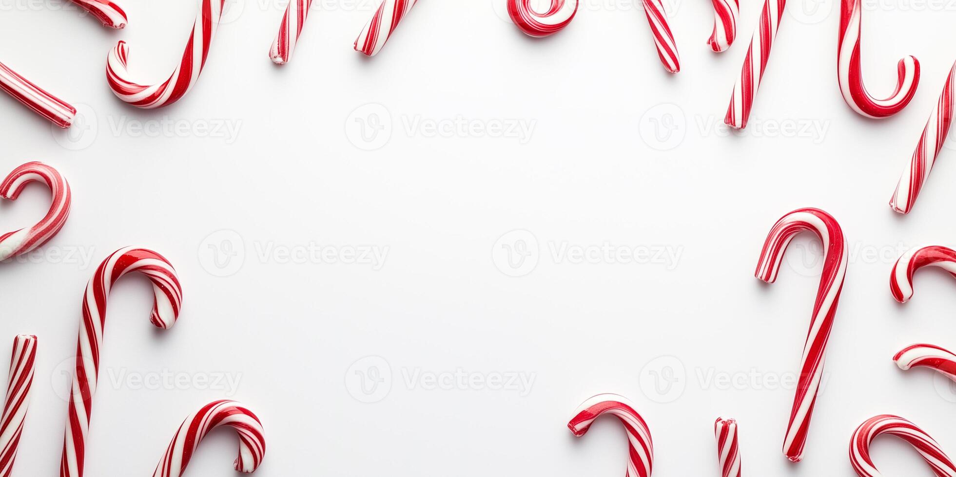 Clusters of candy canes in different orientations fill the left and right corners photo