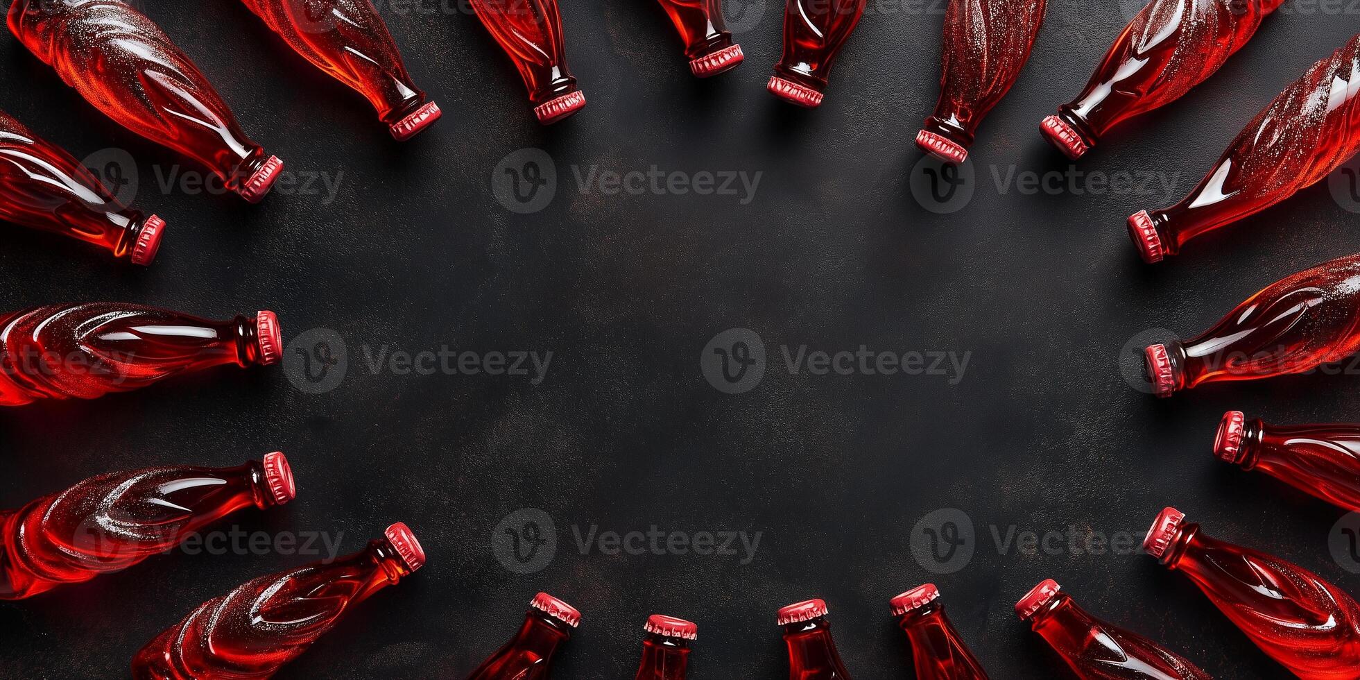 Cola bottle confections arranged in a swirl pattern on dark background photo