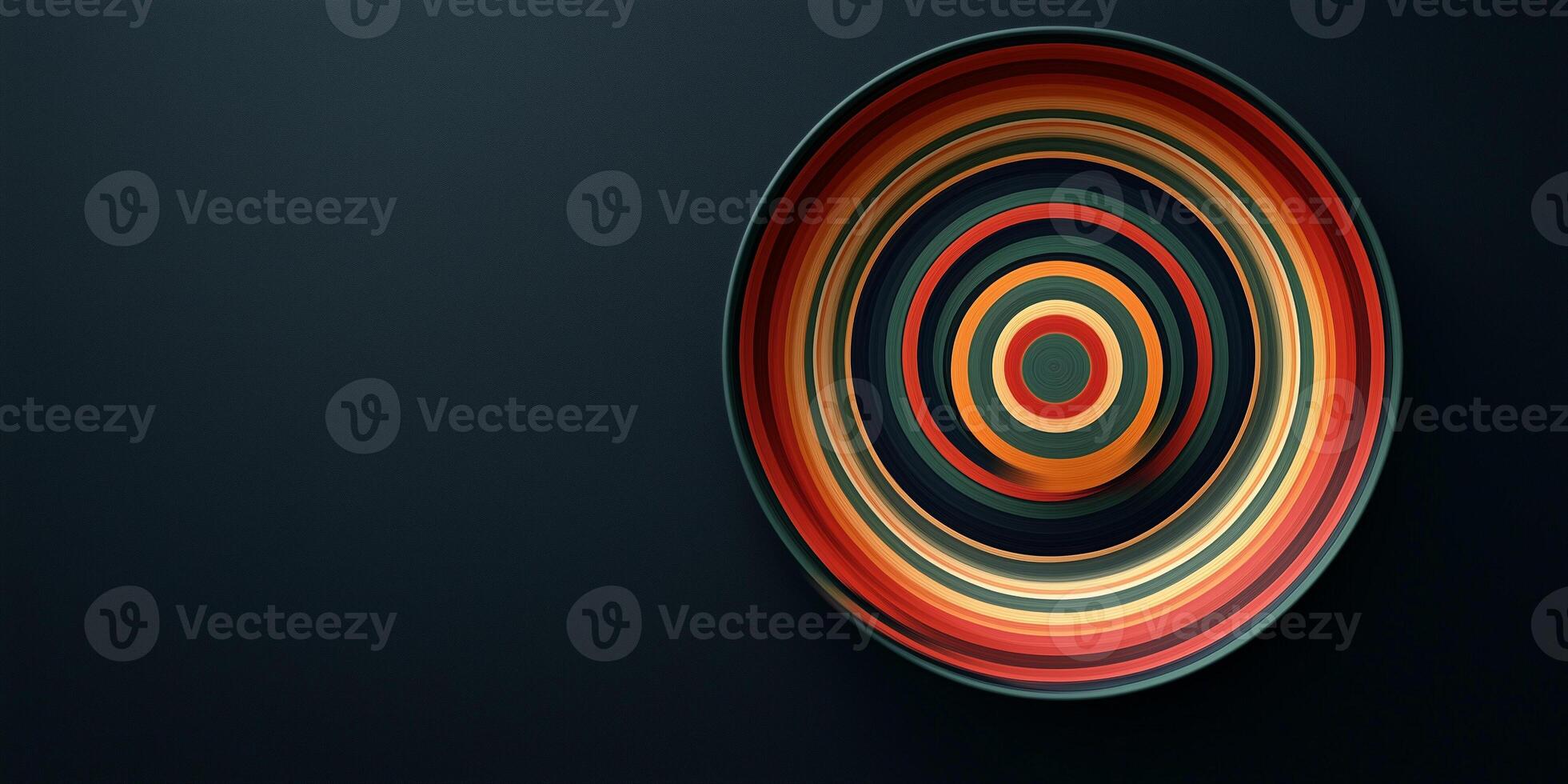 Bite pieces aligned to form concentric circles on dark plate photo