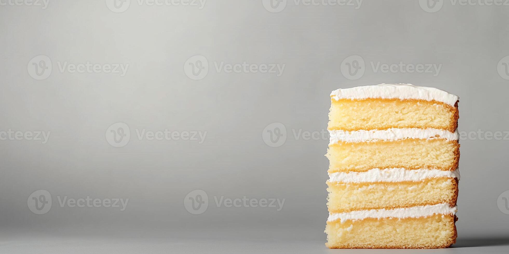 Tall sponge cake at the bottom right, showcasing its layered structure photo