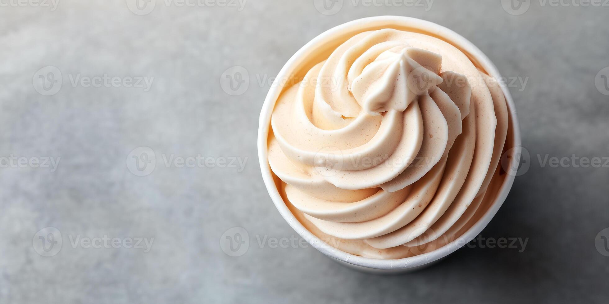 Banana-based soft serve swirled into cup at vegan ice cream shop photo