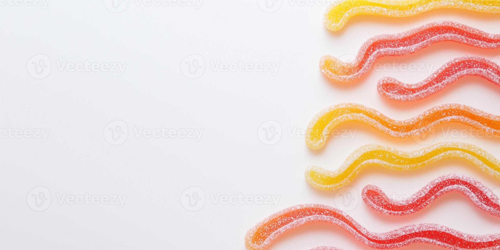 Worm-shaped sweets used to outline a simple drawing on a plain background photo