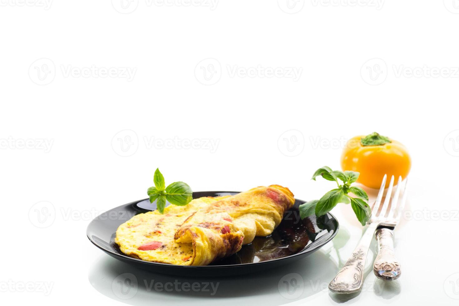 fried omelette with sweet pepper and vegetables in a plate, isolated on white background photo