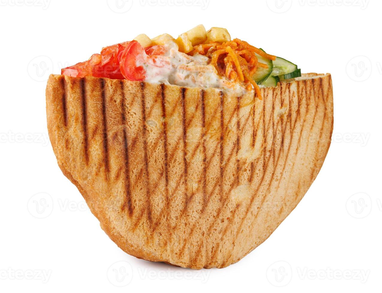 Doner with a crispy crust and tasty filling with sauce isolated on a white background. photo