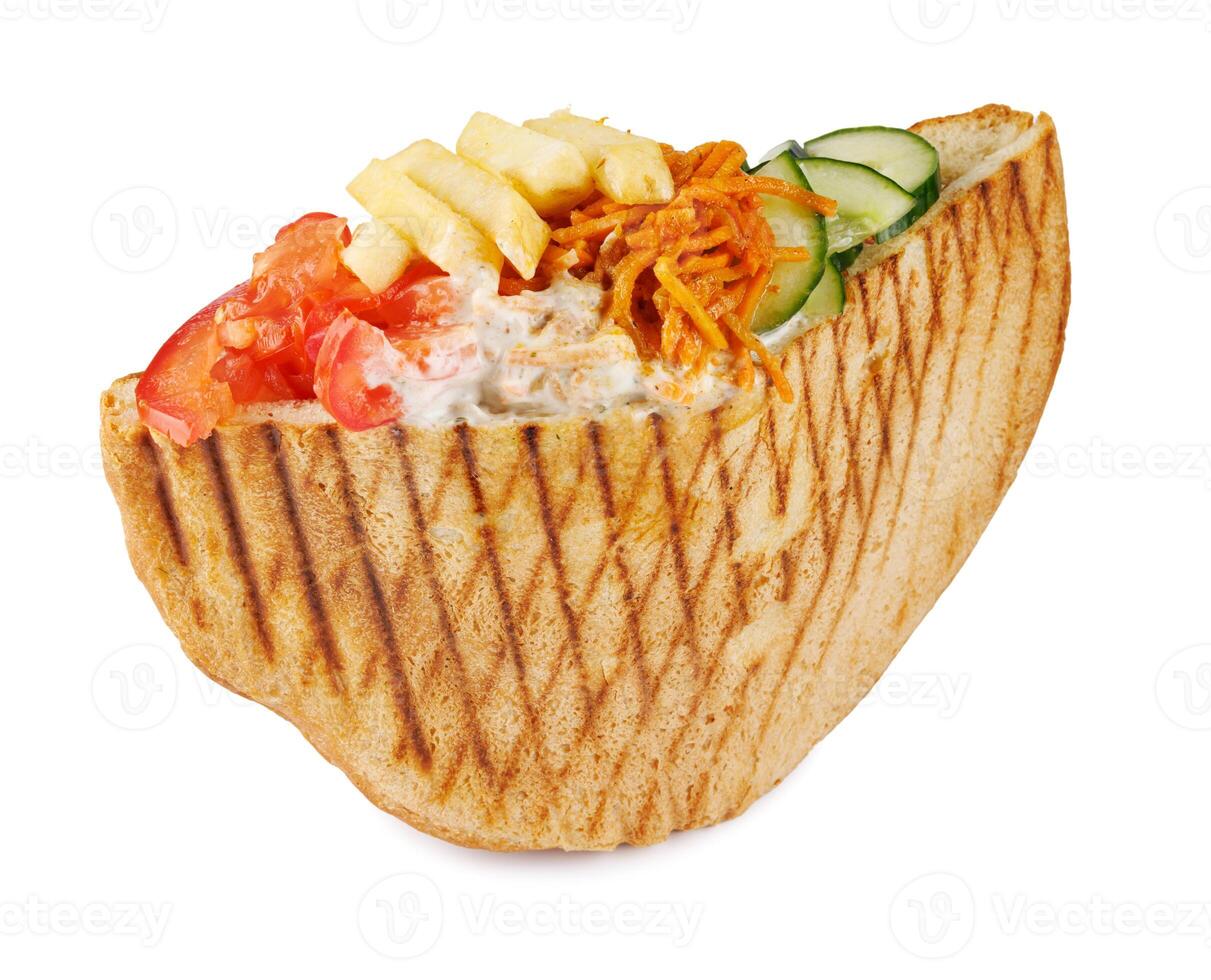 Doner with a crispy crust and tasty filling with sauce isolated on a white background. photo