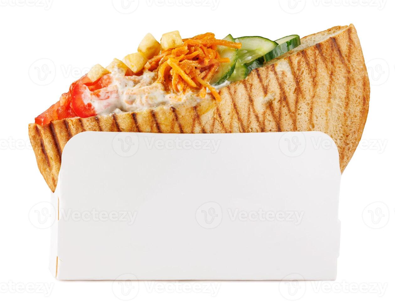 Doner with a crispy crust and tasty filling with sauce isolated on a white background. photo