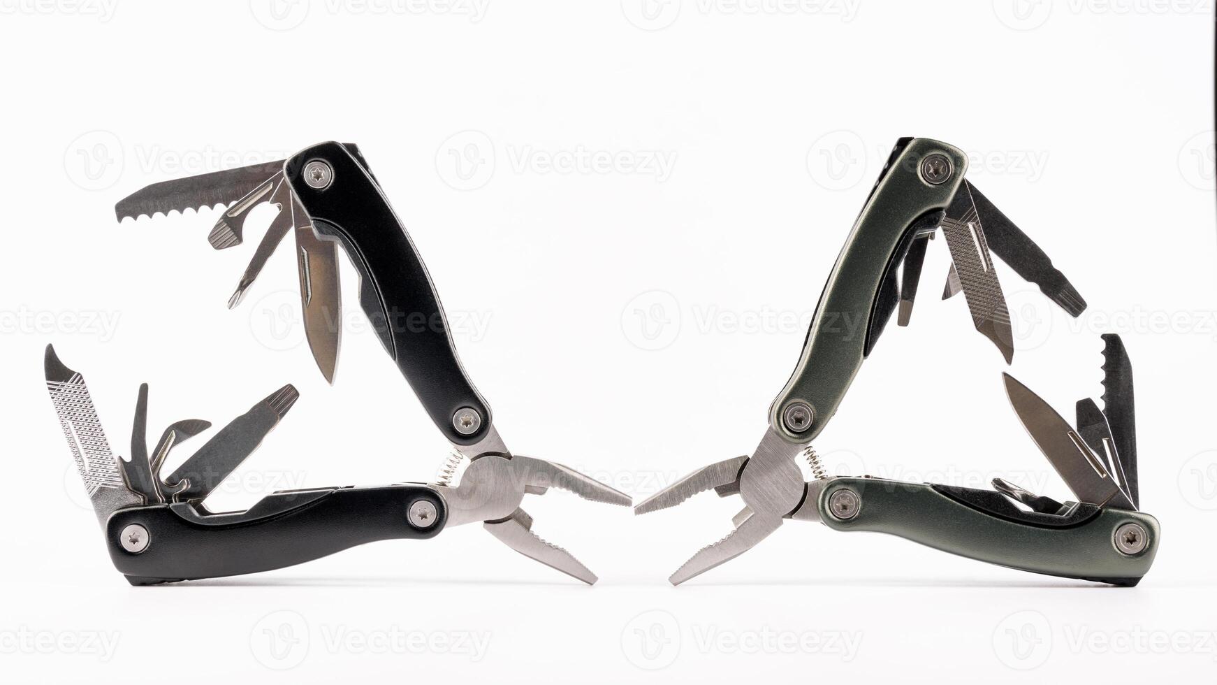 Steel multitool isolated on white background. Opened multitool with pliers, file, blade, screwdriver, bottle opener and saw, with a white background. Multi tool with expanded tools and pliers photo