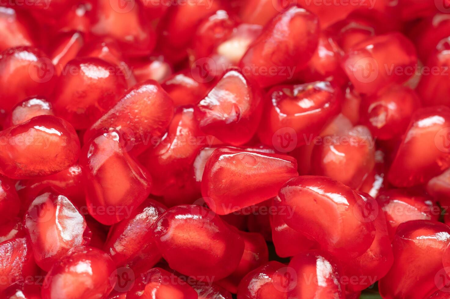 Ripe pomegranate seeds ready to eat. photo