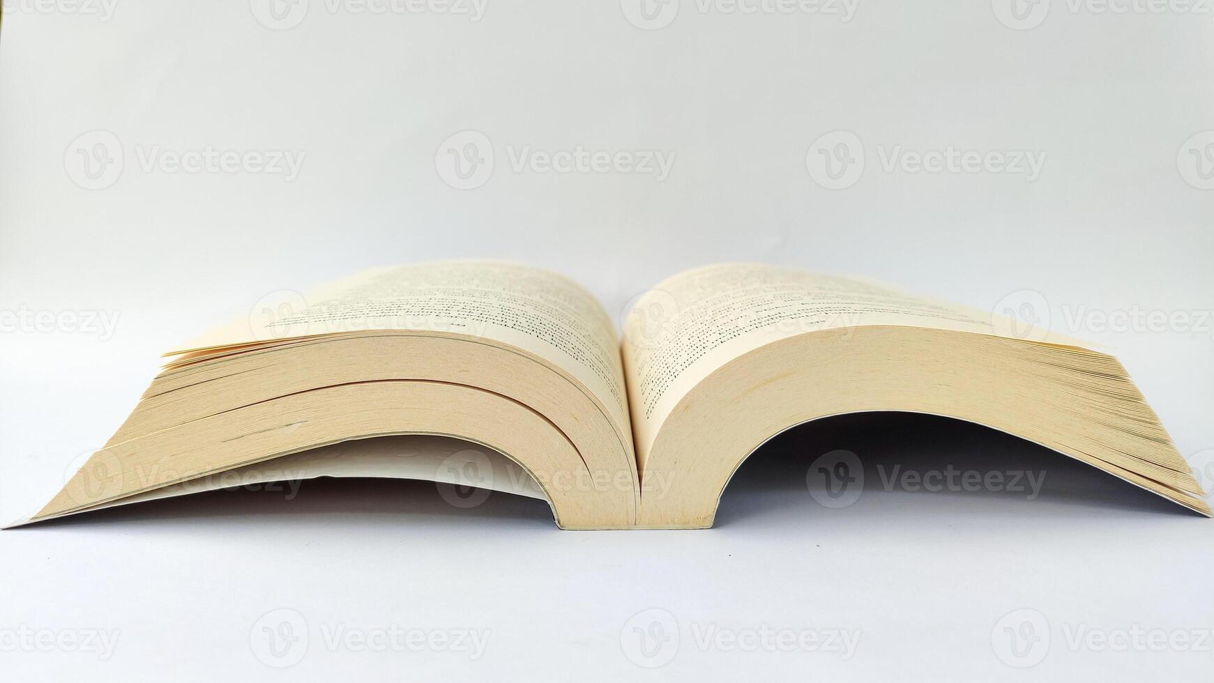 stack of colorful books on white background, open book, stack of books isolated on background, education, read, study, school, library, dictionary. photo