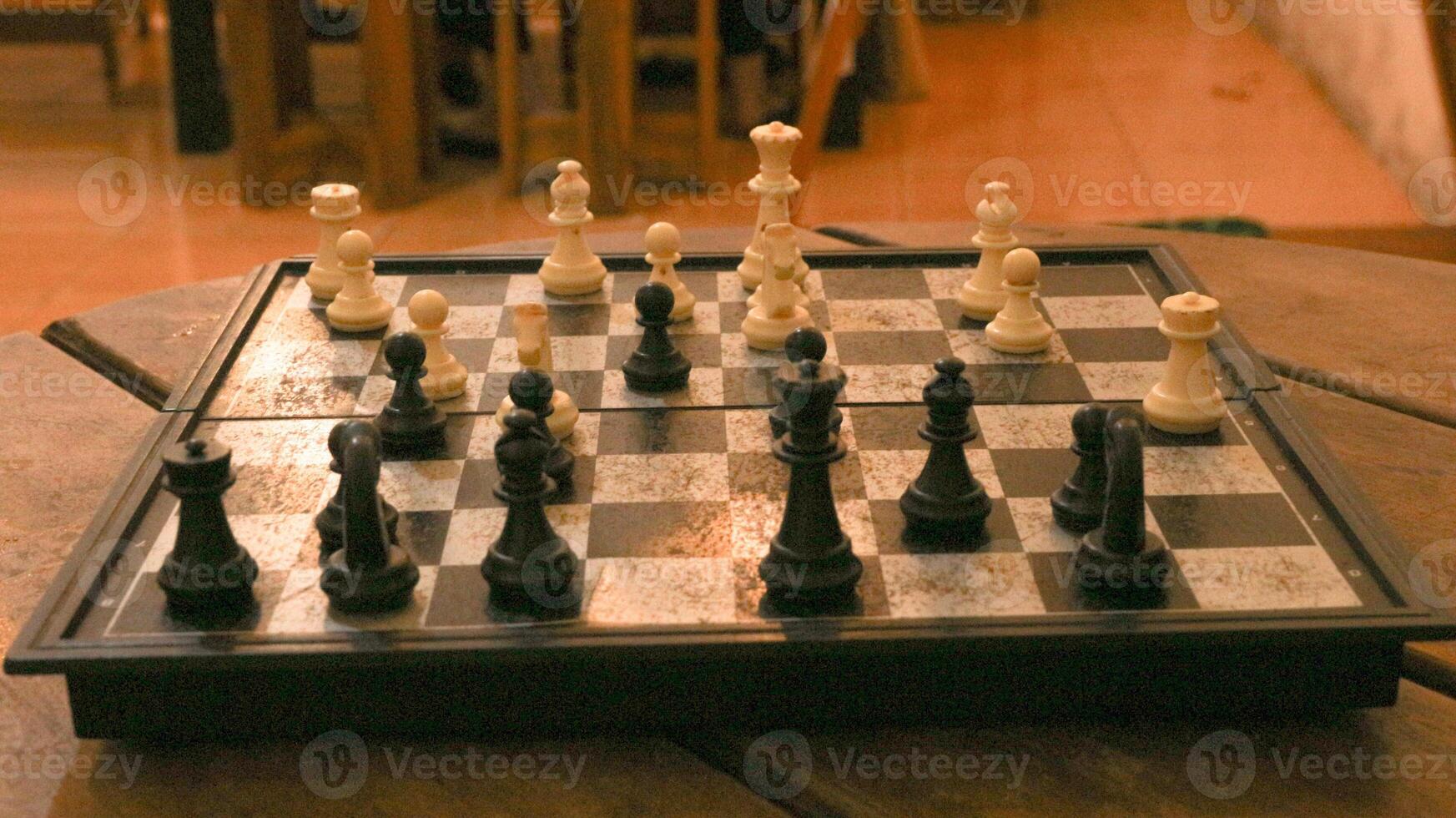 Chess pieces on the chessboard. Chess Game. Close Up Playing a Game of Chess. Strategy game that requires concentration and intelligence. photo