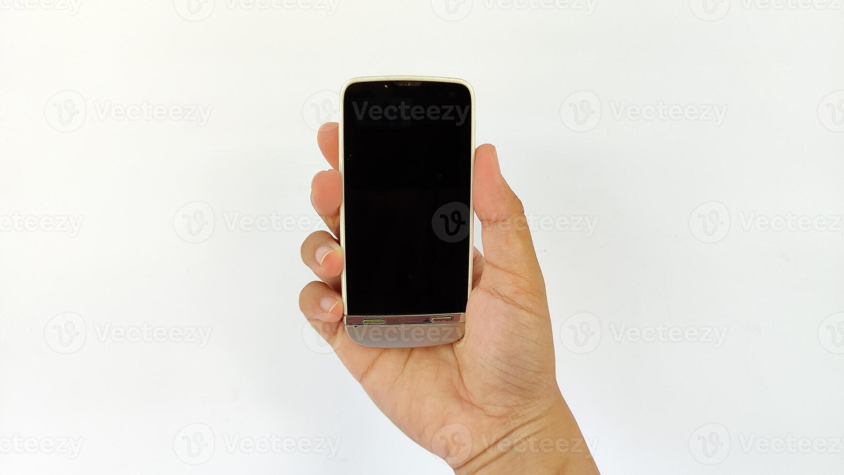 Closeup shot of hand holding handphone photo