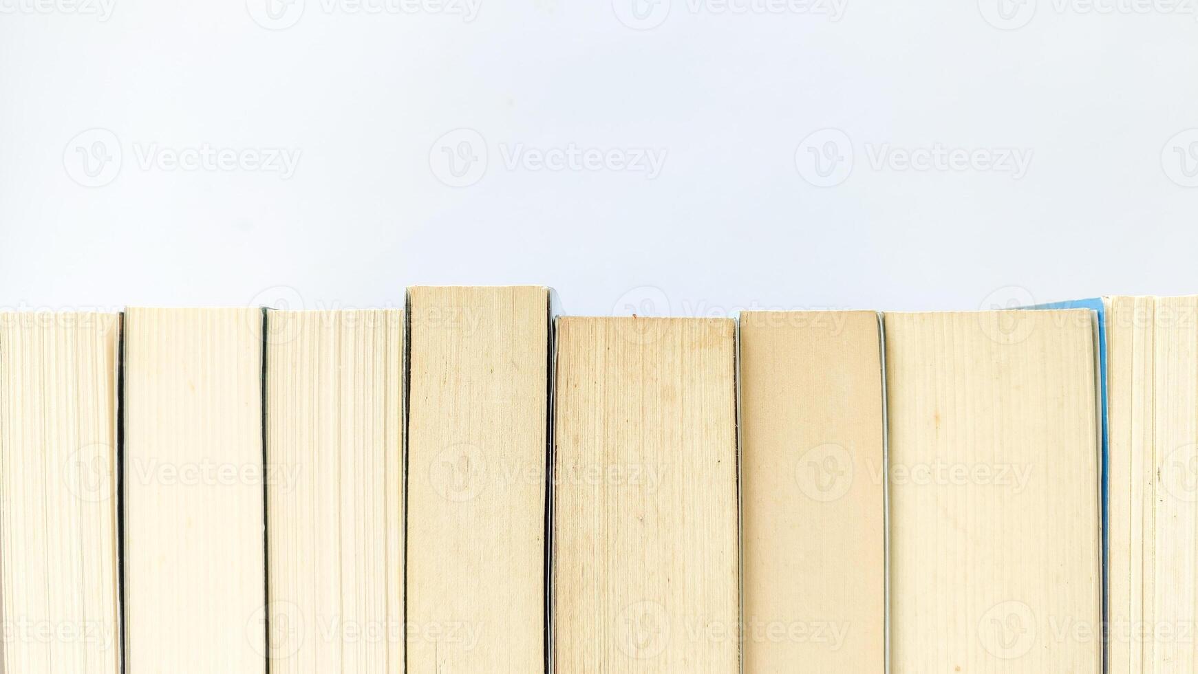 stack of colorful books on white background, open book, stack of books isolated on background, education, read, study, school, library, dictionary. photo