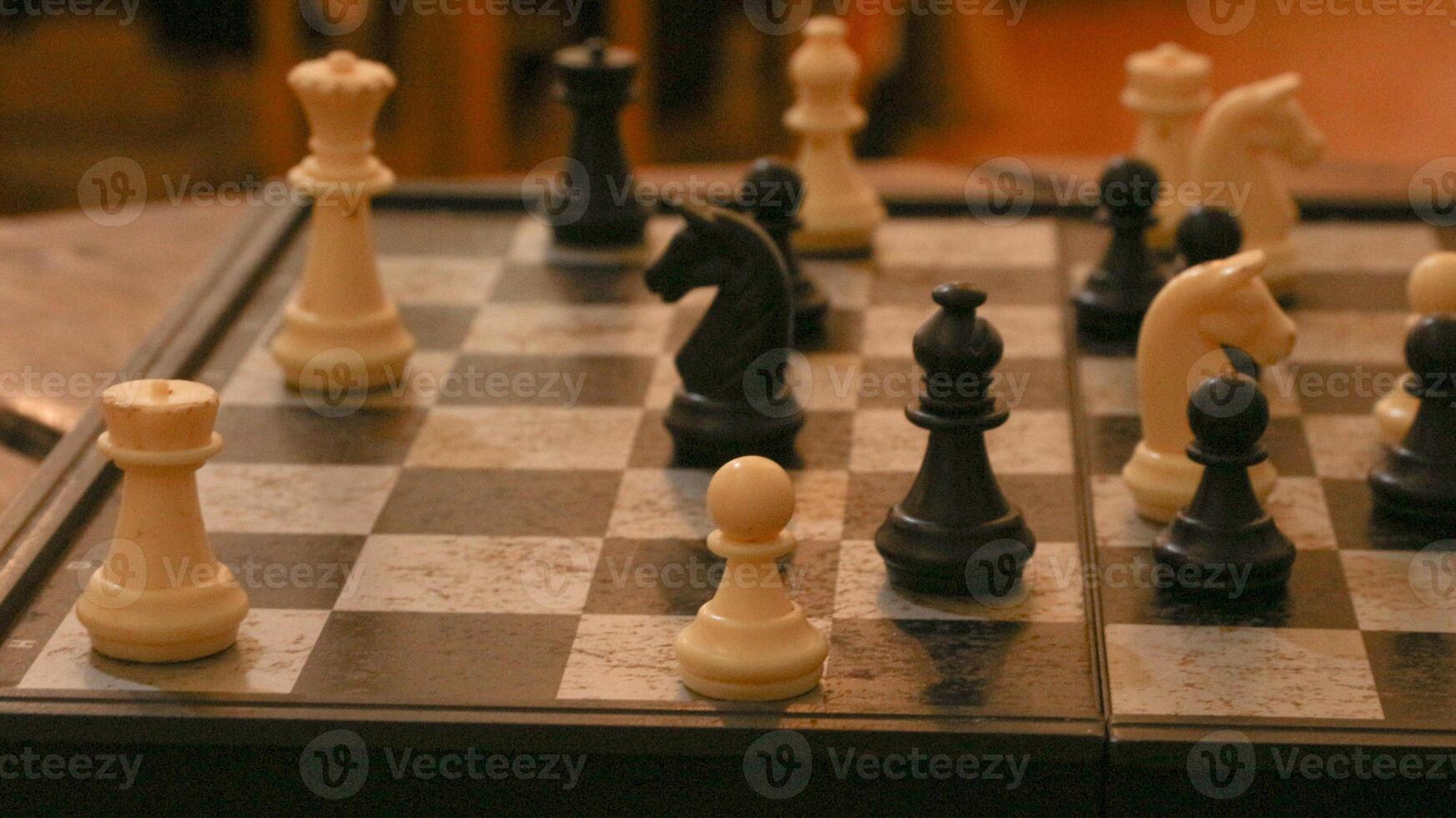 Chess pieces on the chessboard. Chess Game. Close Up Playing a Game of Chess. Strategy game that requires concentration and intelligence. photo
