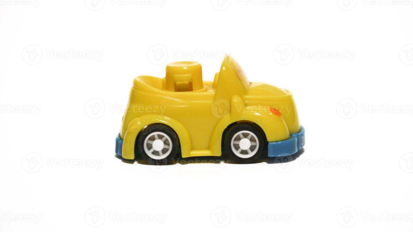 Plastic children's toys on a white background. small white car. Plastic children's toys. Children's toy. photo