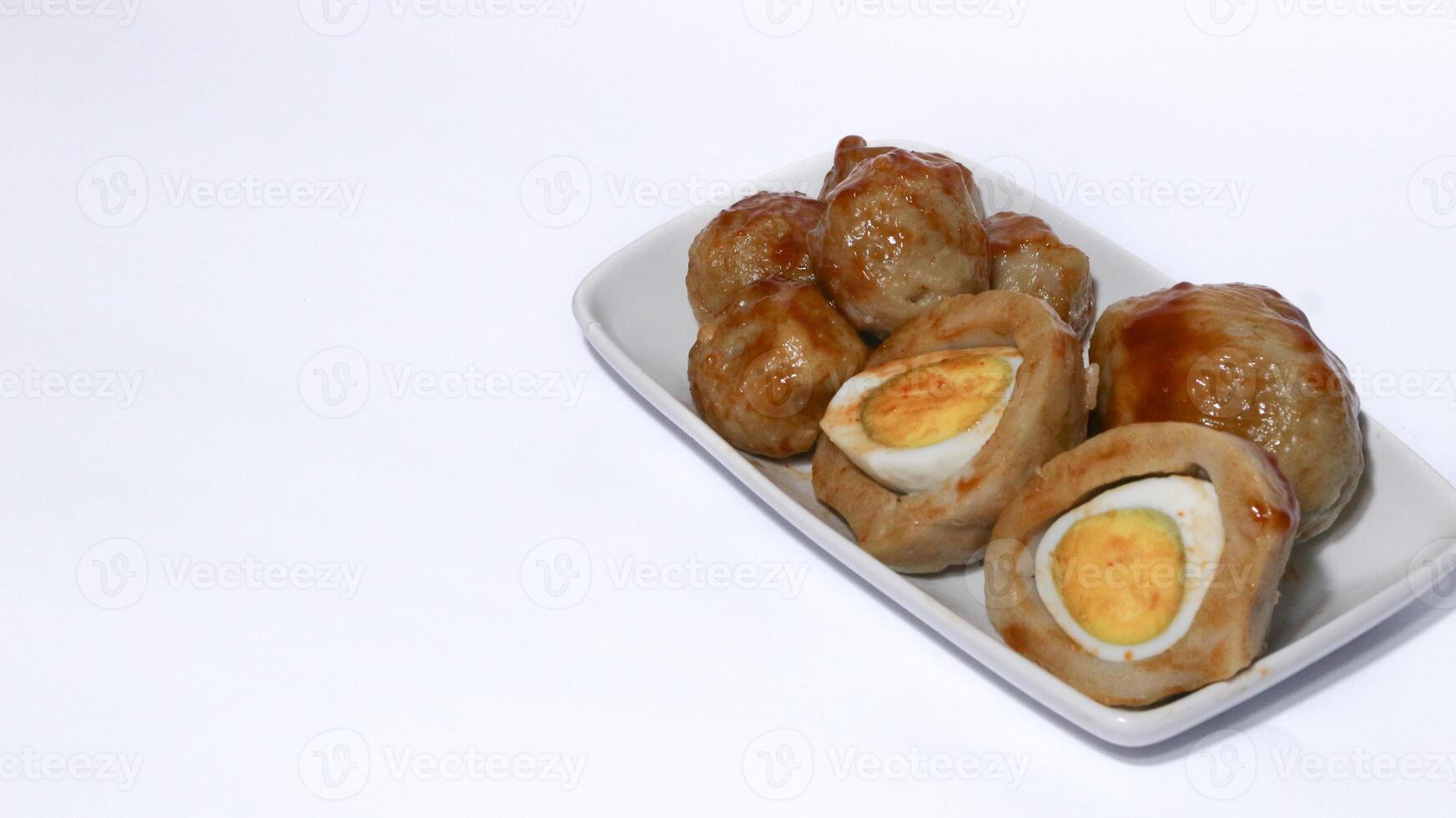 Pentol is a typical Indonesian spicy snack made from beef and tapioca flour. photo