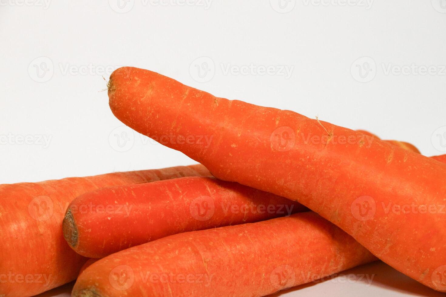 Group of fresh carrots isolated on white background. photo