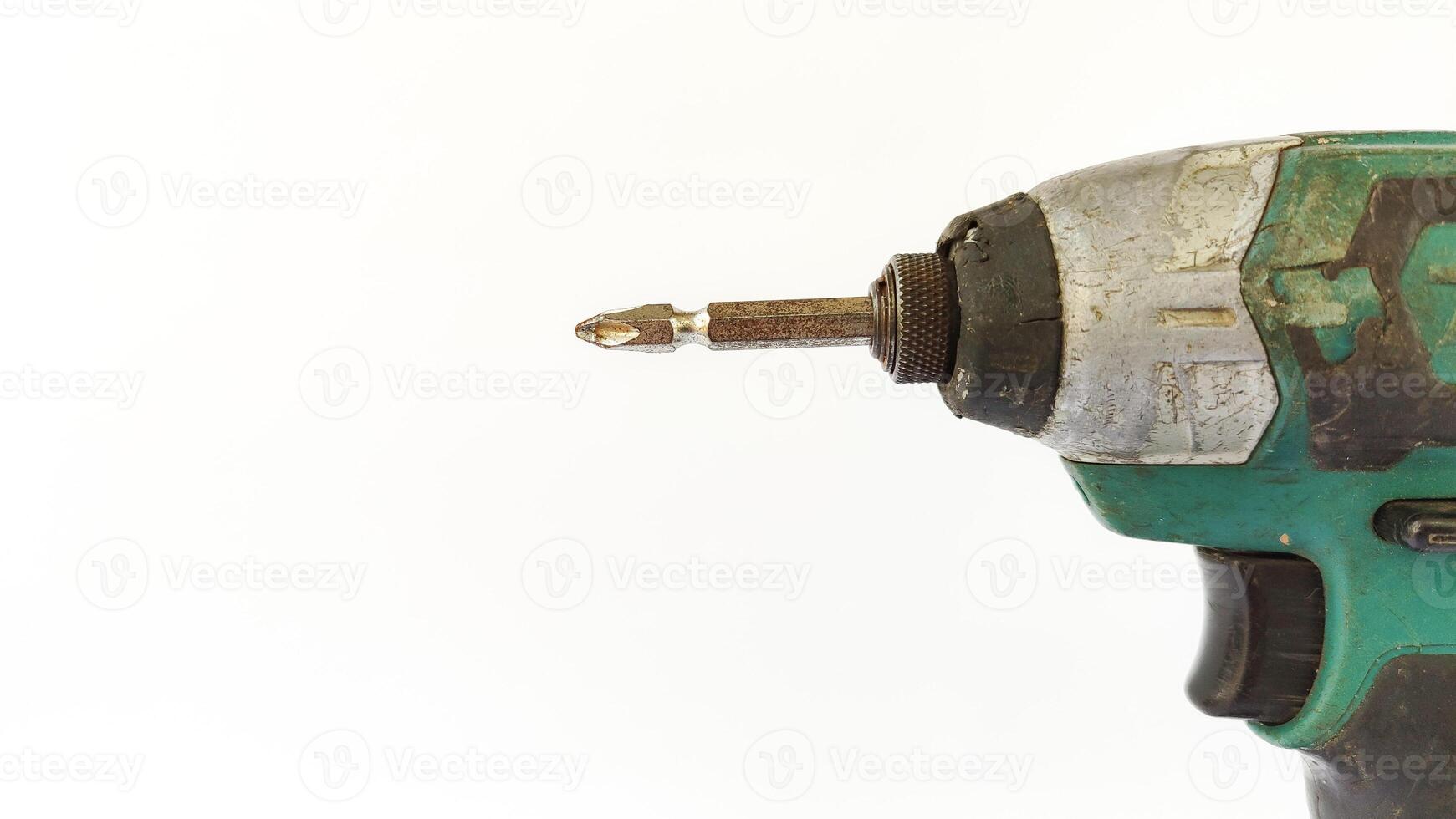 Cordless drill with drill bits, white background for copy space. photo