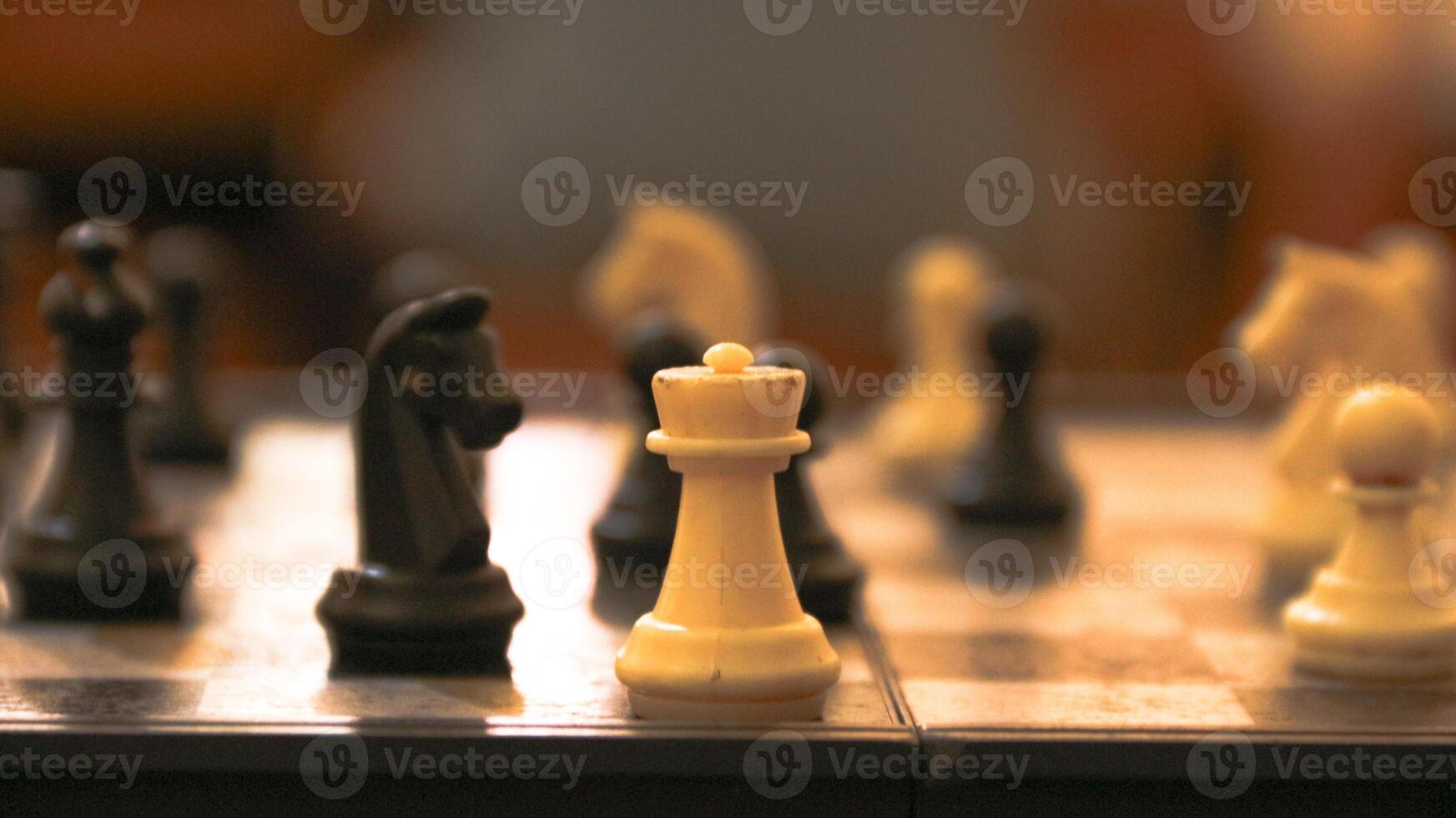 Chess pieces on the chessboard. Chess Game. Close Up Playing a Game of Chess. Strategy game that requires concentration and intelligence. photo