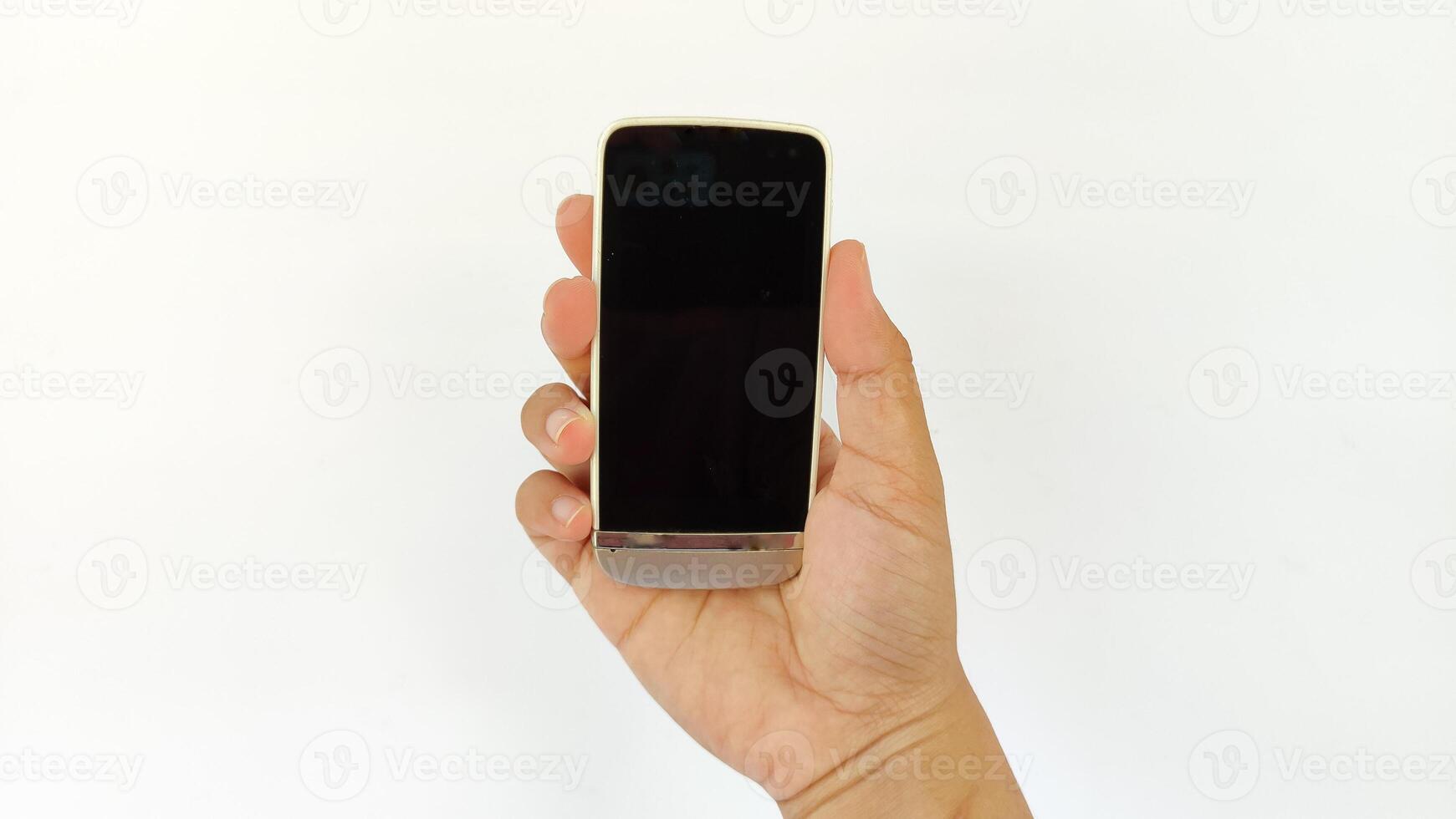 Closeup shot of hand holding handphone photo
