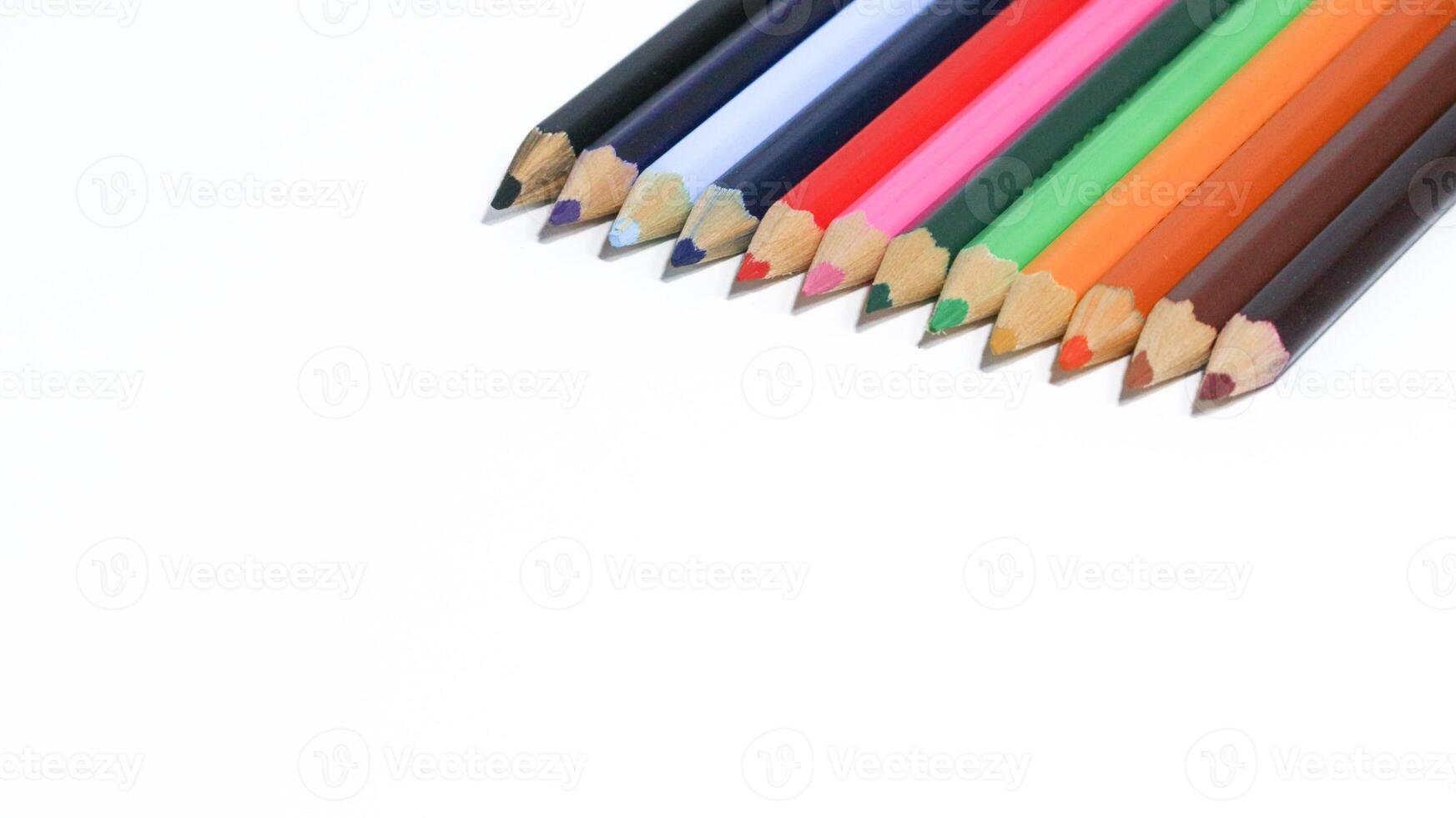 Color pencils isolated on white background photo