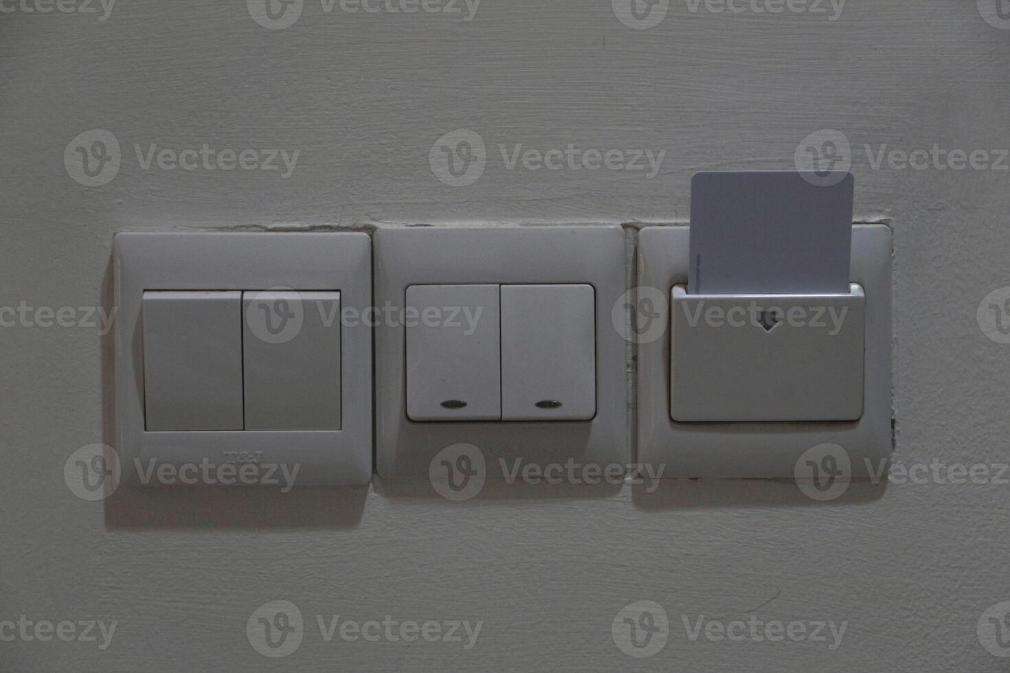 Hotel open room card system with light switch white wall. Horizontal photo
