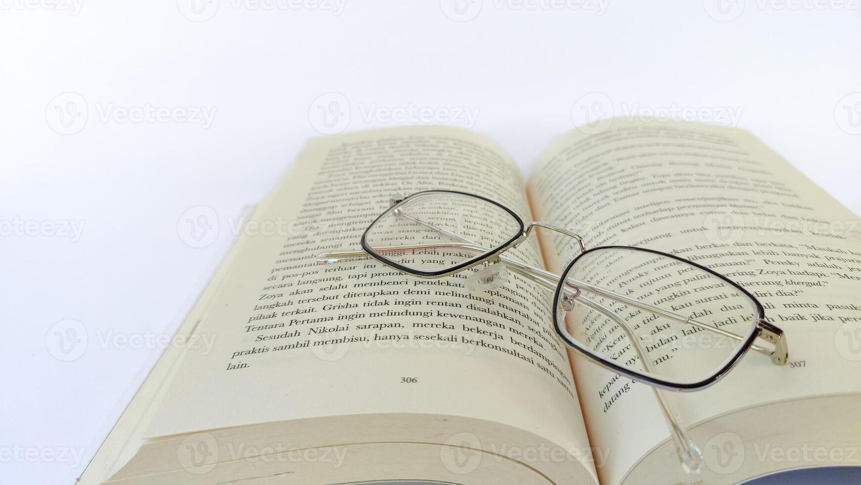 stack of colorful books on white background, open book, stack of books isolated on background, education, read, study, school, library, dictionary. photo