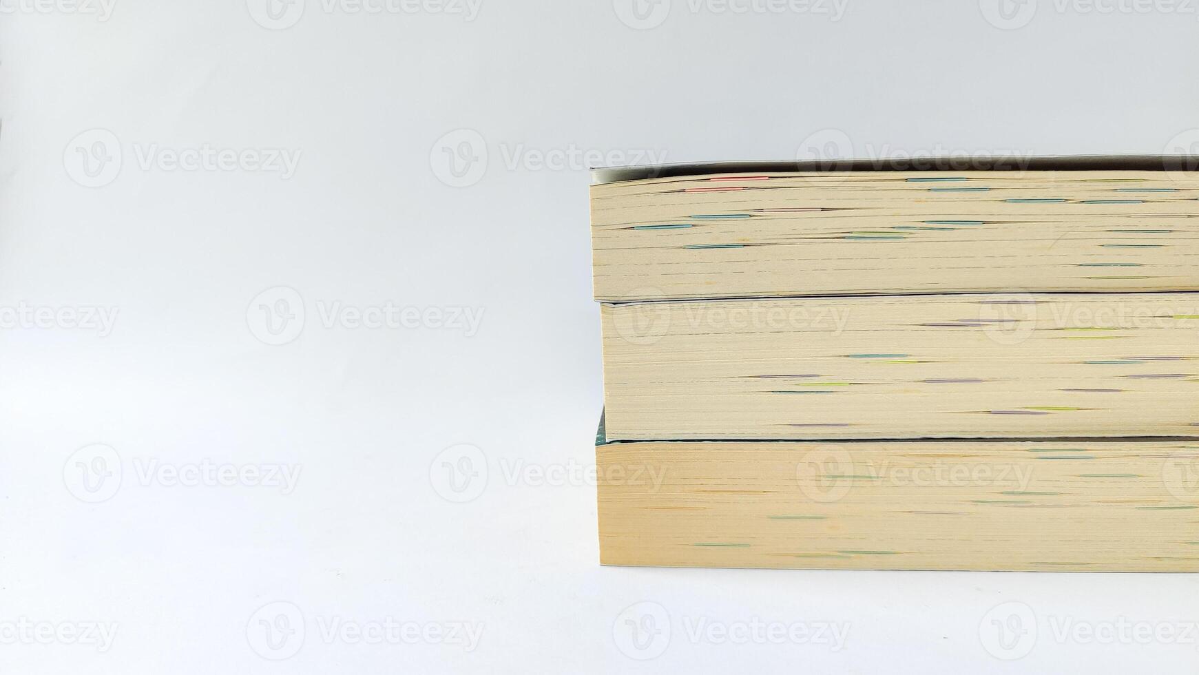 stack of colorful books on white background, open book, stack of books isolated on background, education, read, study, school, library, dictionary. photo