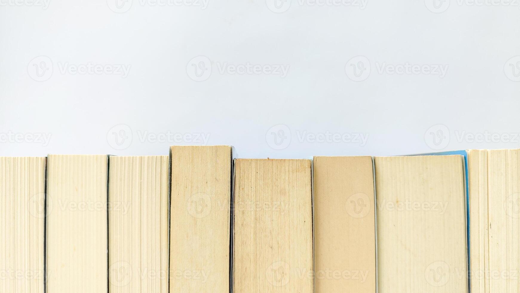 stack of colorful books on white background, open book, stack of books isolated on background, education, read, study, school, library, dictionary. photo