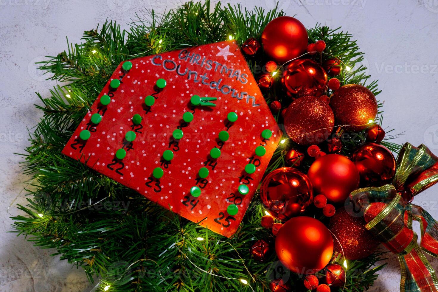 Wooden Christmas advent house calendar handmade Storytelling creating craft Christmas holiday decoration. Tactile hand-on activity. Master class progress of creative me-made gifts. Seasonal domestic life micro moment hobby. Sustainable living photo