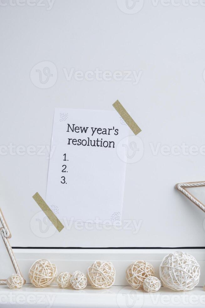 Motivational paper note NEW YEAR'S RESOLUTION. Goals setting concept. Strategy for self development improvement. Inspirational Planning better healthier life. Visual motivation photo