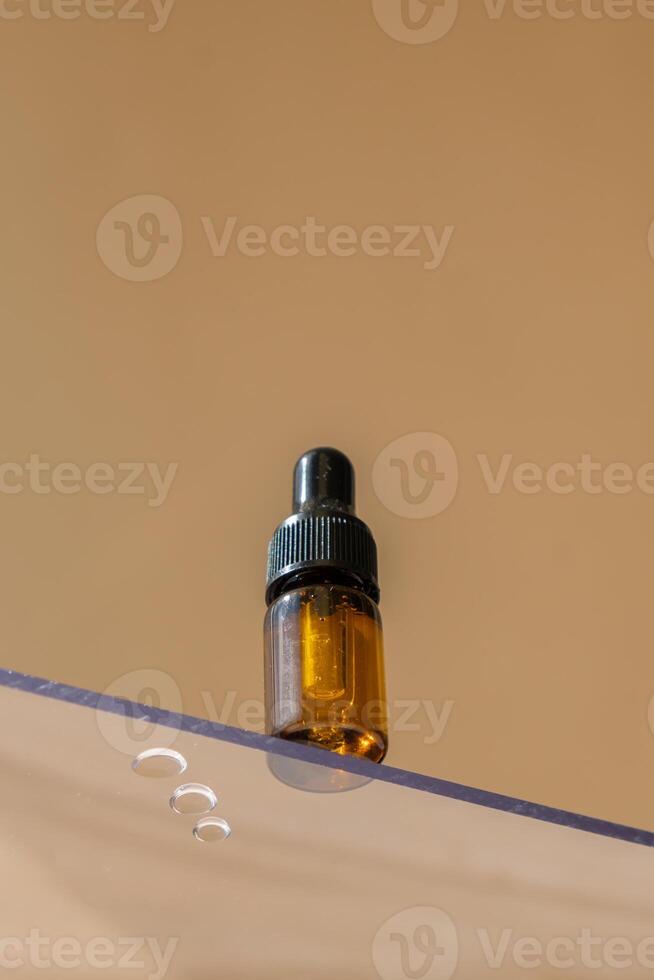 Looking isometric through the window on natural herbal essential oil. Eco organic glass dropper. Earth tones Natural cosmetics ingredients for skincare, body and hair care spa. Concept of alternative medicine beauty treatments. photo