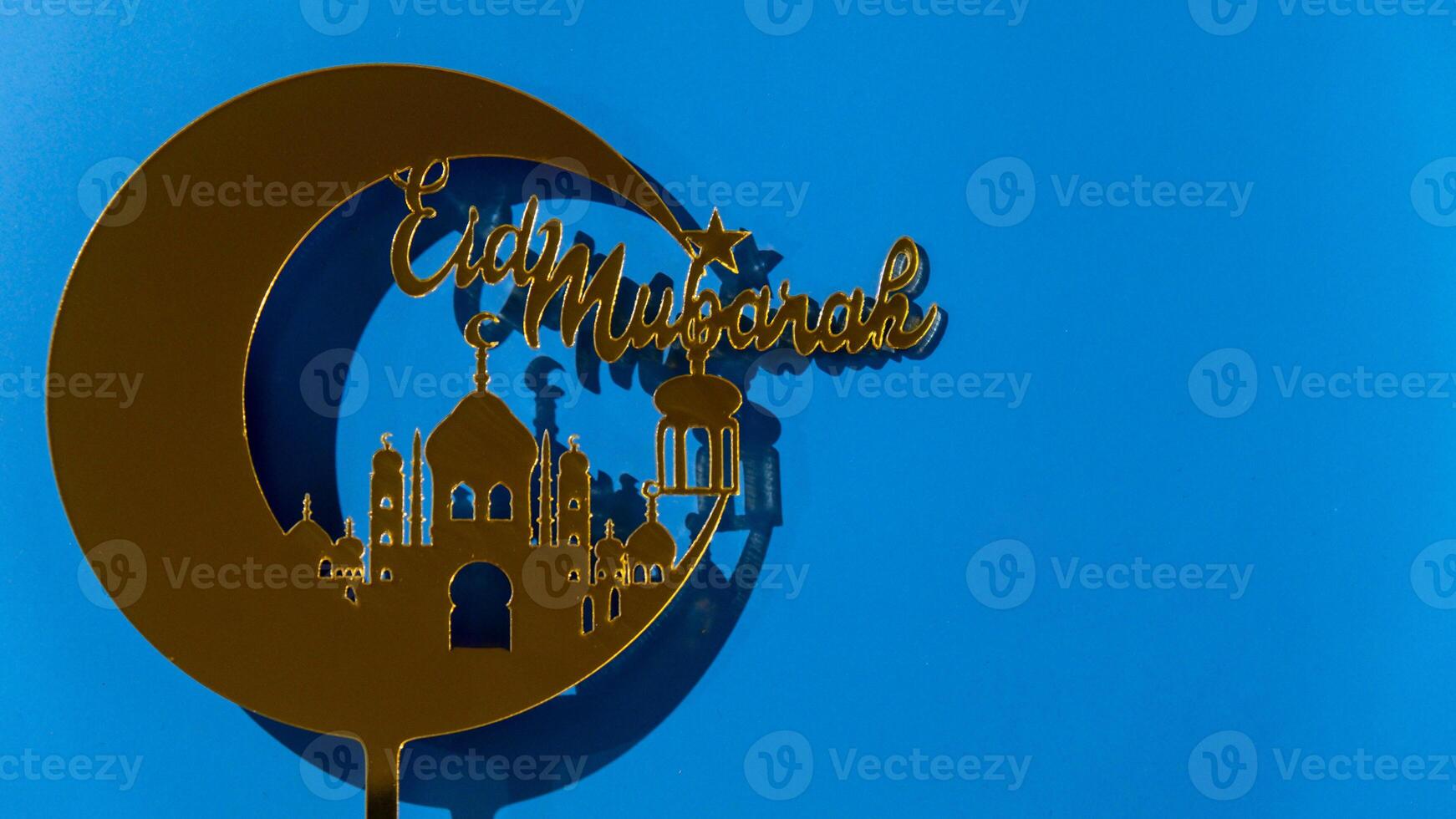 Crescent moon at top of mosque. Eid Mubarak text creative conceptual poster design for advertising branding. Mock up template for greeting card postcard. Ramadan Kareem background. Traditional muslim holiday. Copy space photo