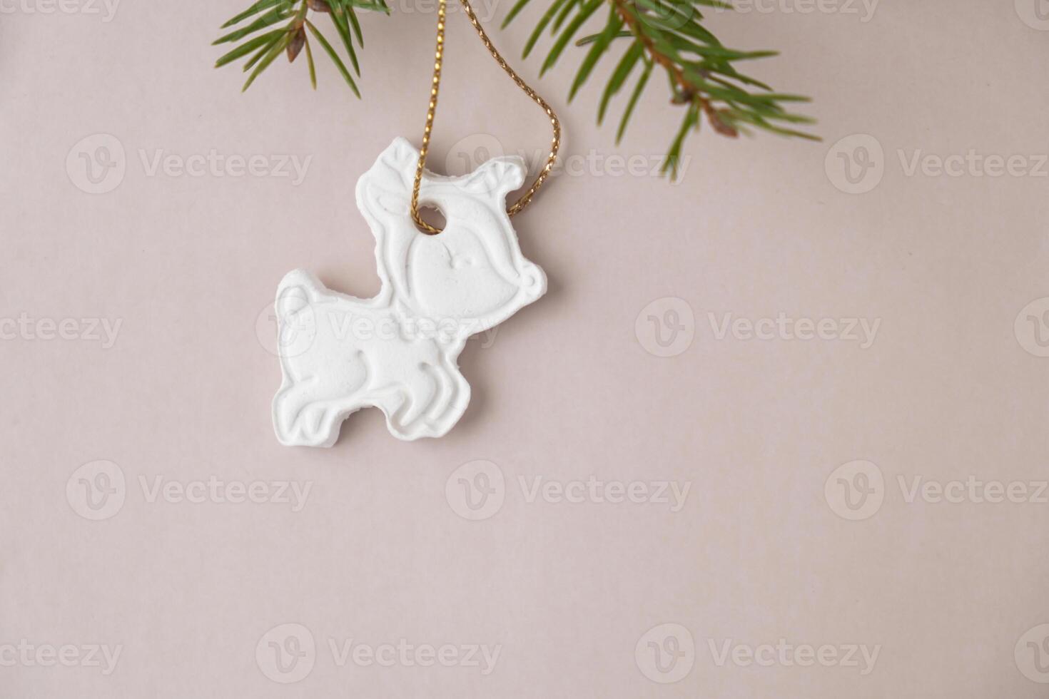 Christmas deer White air dry clay for making decor to Christmas tree holiday. Creating hobby recreation activity that involves fingers. DIY crafting Modern art photo