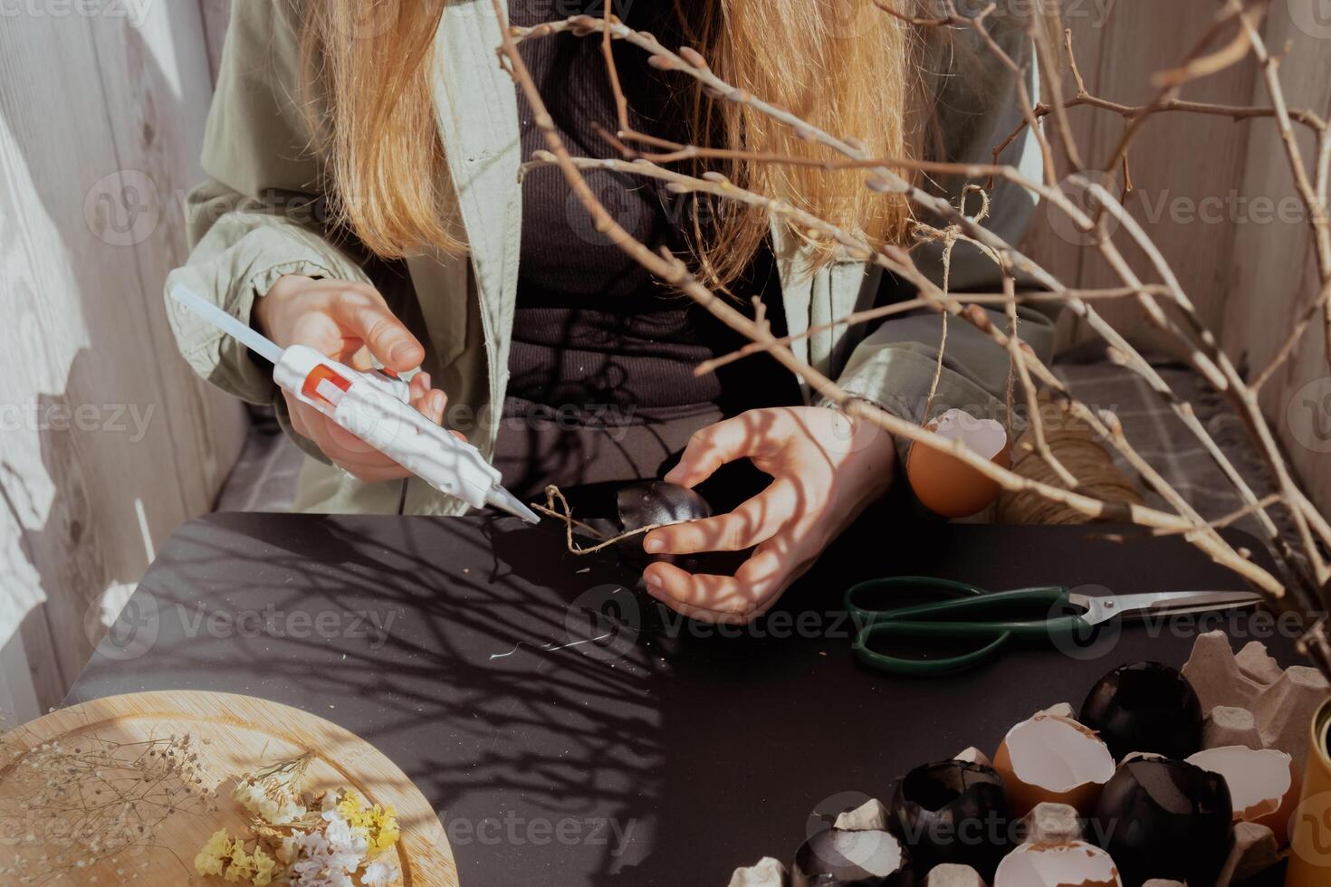 Tutorial How to make Easter table decoration with egg shells step by step instruction. Easter home decoration on wooden branch. Seasonal sustainable recycled decor photo