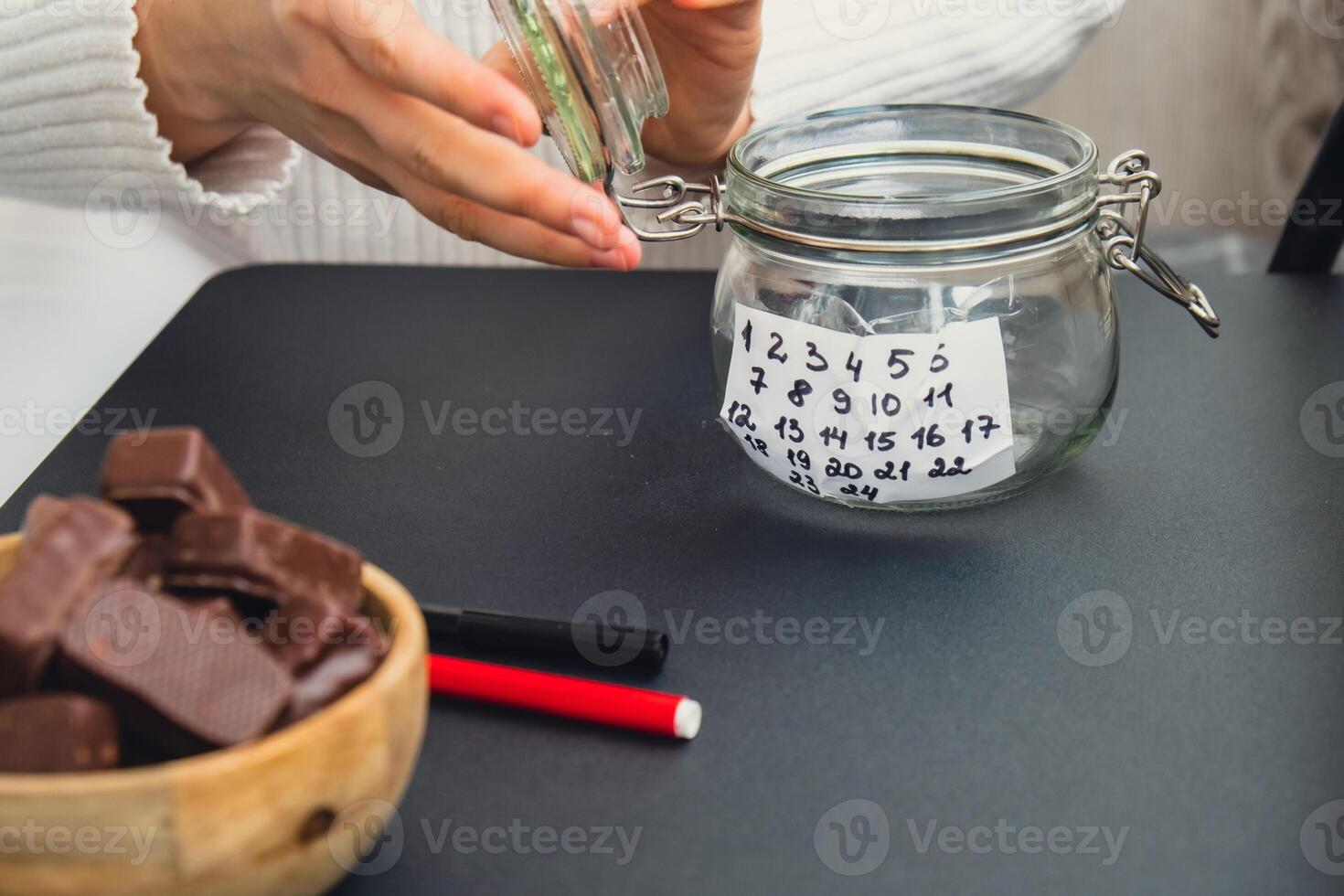 Step by step instruction of making handmade Christmas advent sweet candies delicious calendar. Female hands creating craft homemade decor. New year celebration. Winter holidays photo