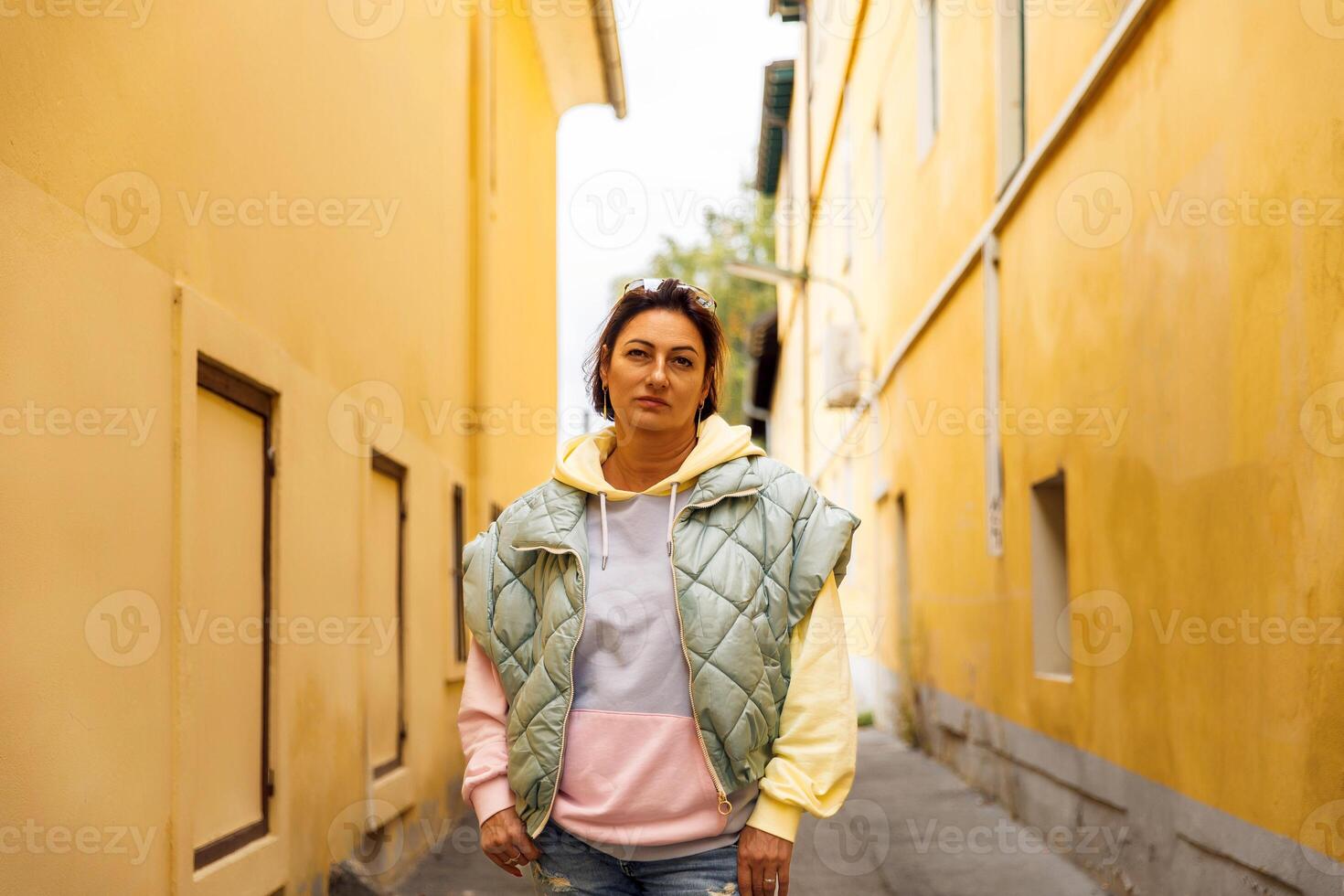 Casual fashion in vibrant urban alleyway photo