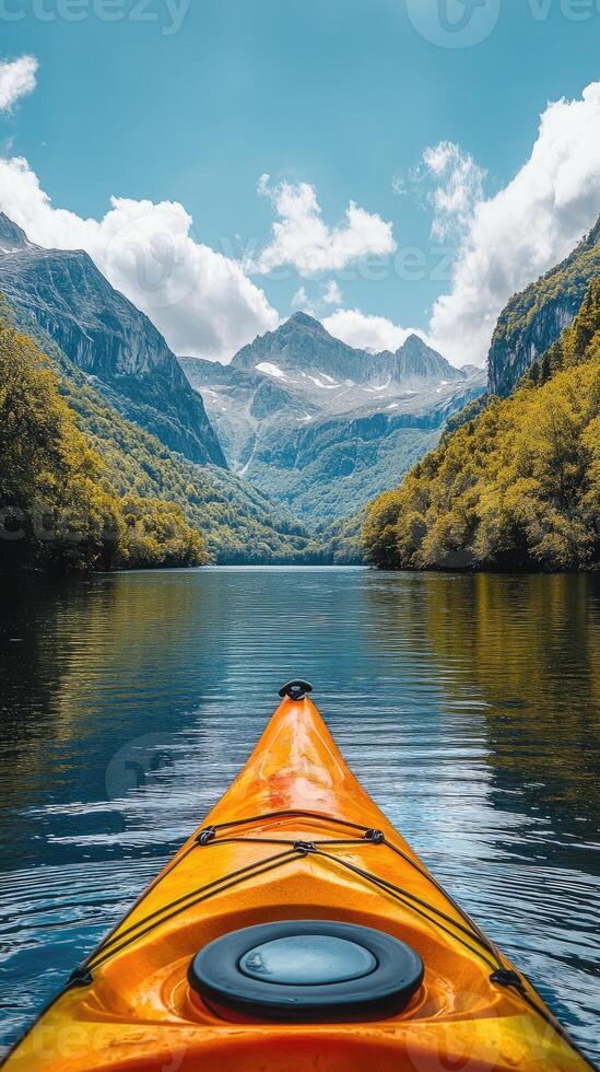 Kayaking on a calm lake surrounded by mountains photo