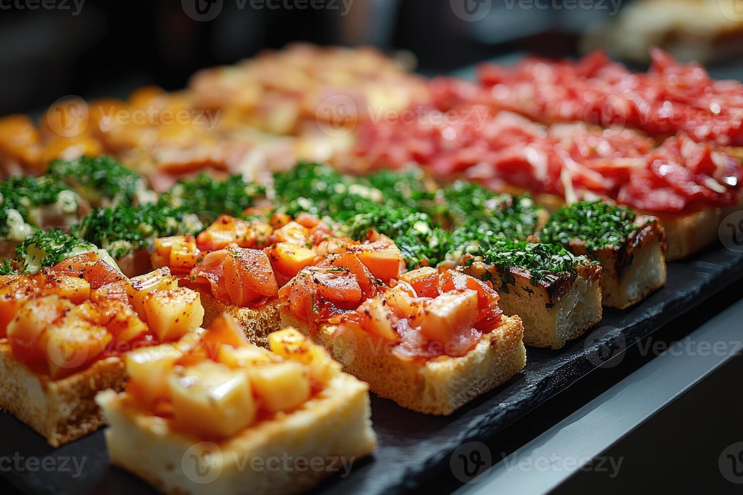 Bruschetta appetizers with tomatoes and cream cheese are served on a tray photo