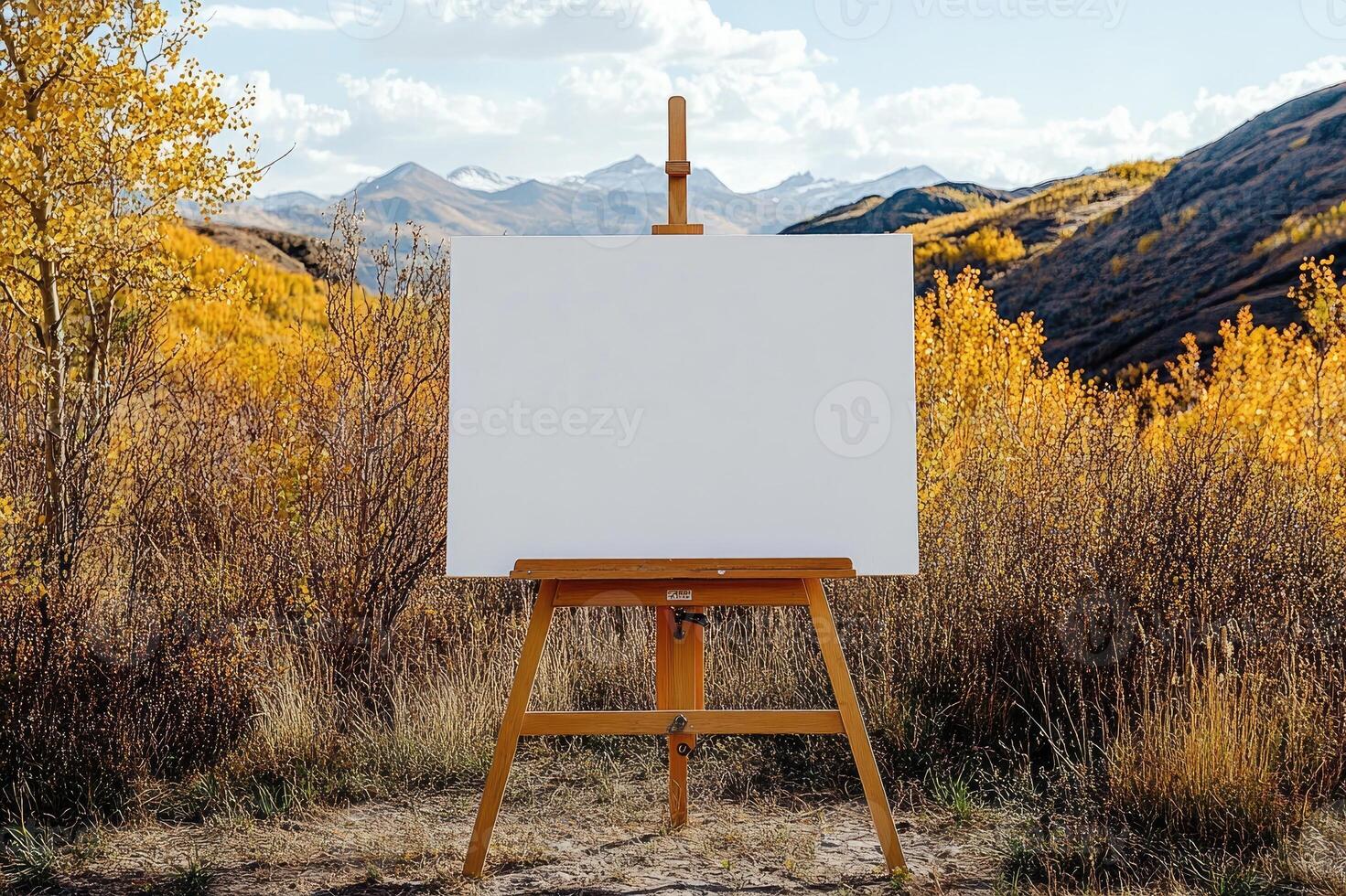 Blank canvas on easel in beautiful autumn mountain landscape painting scenery photo