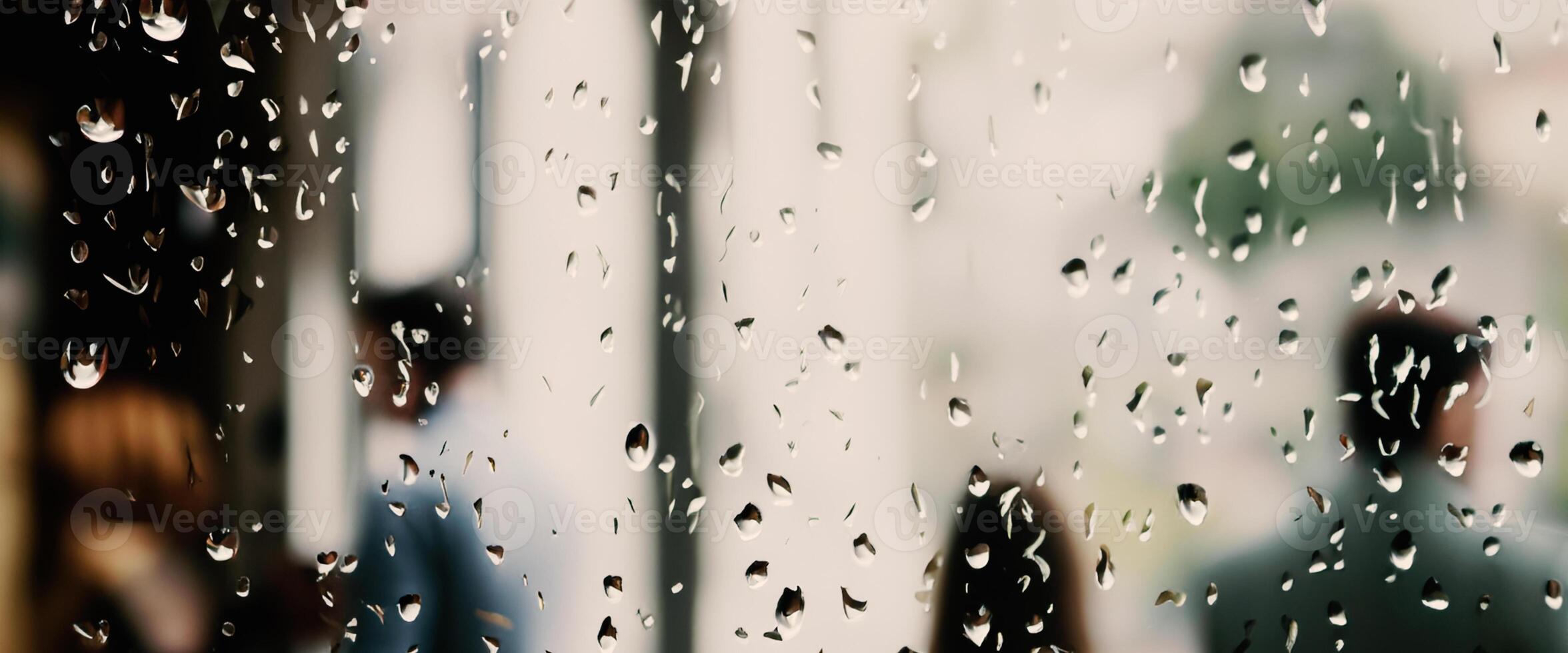 Rain drop on window glass of coffee shop and blurry city life background. Rainy season and blurry people city day life or bokeh night lights outside window. Coffee shop window covered with rain water photo