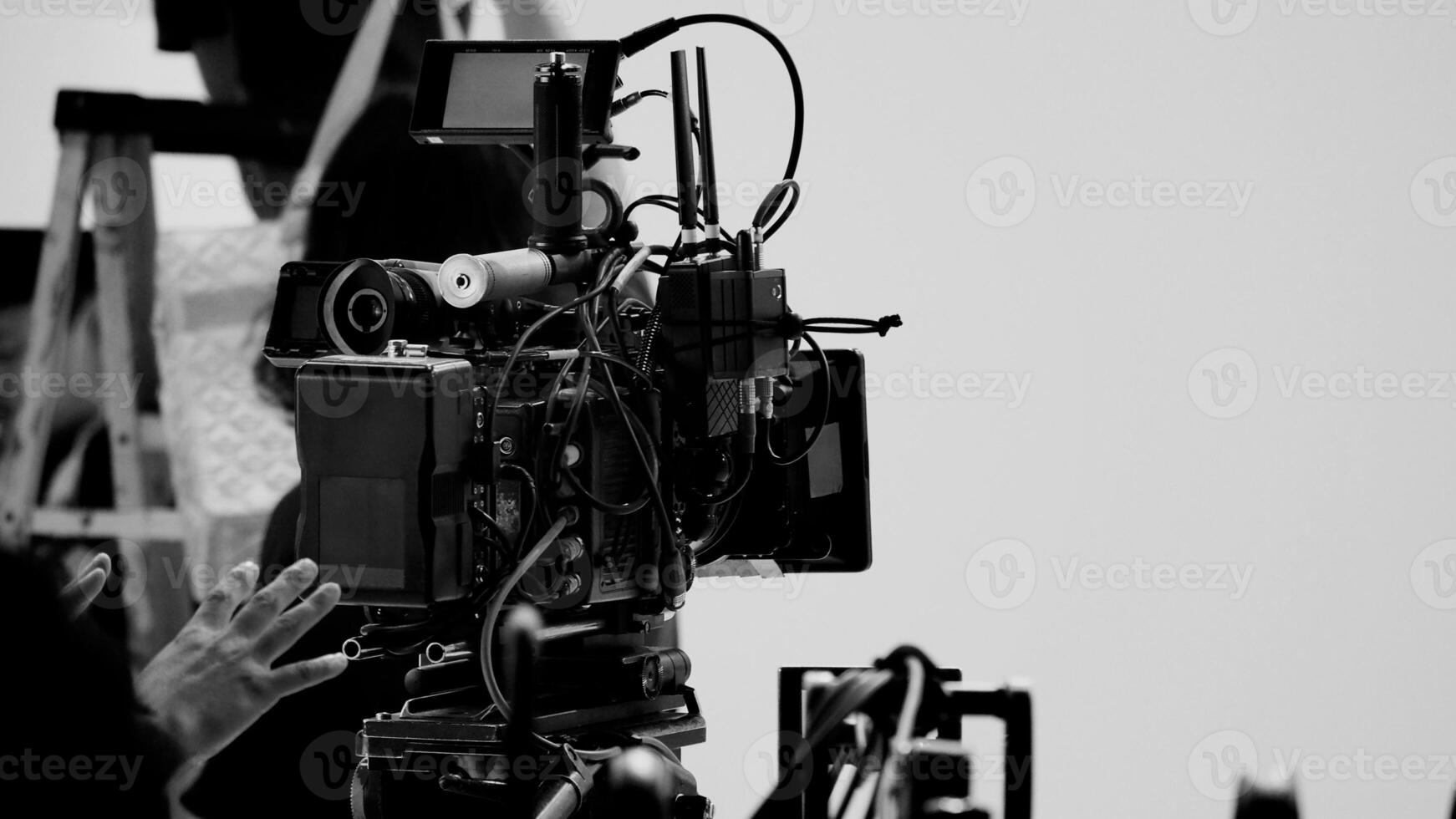 Film director and crew making commercial content advertising in studio. photo